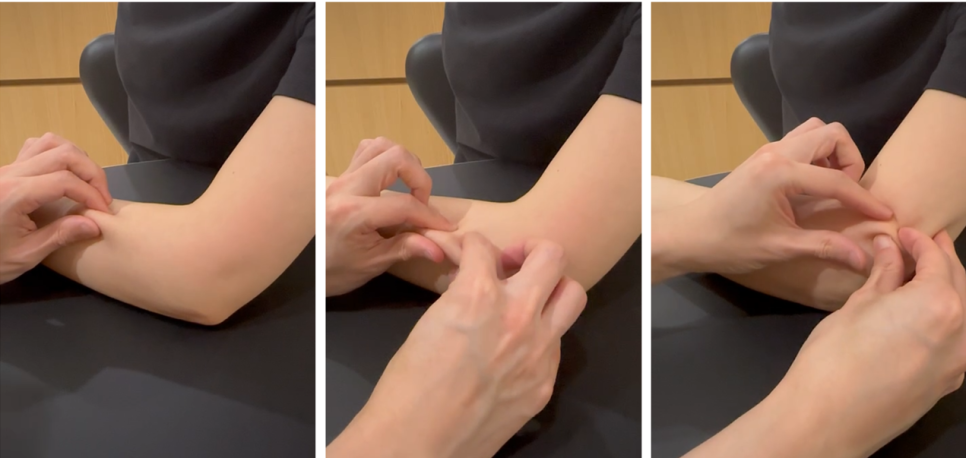 한 사람이 다른 사람의 팔꿈치 바깥쪽을 손으로 만져 촉진하는 모습 — 서울 바로한의원 초음파 약침·도침